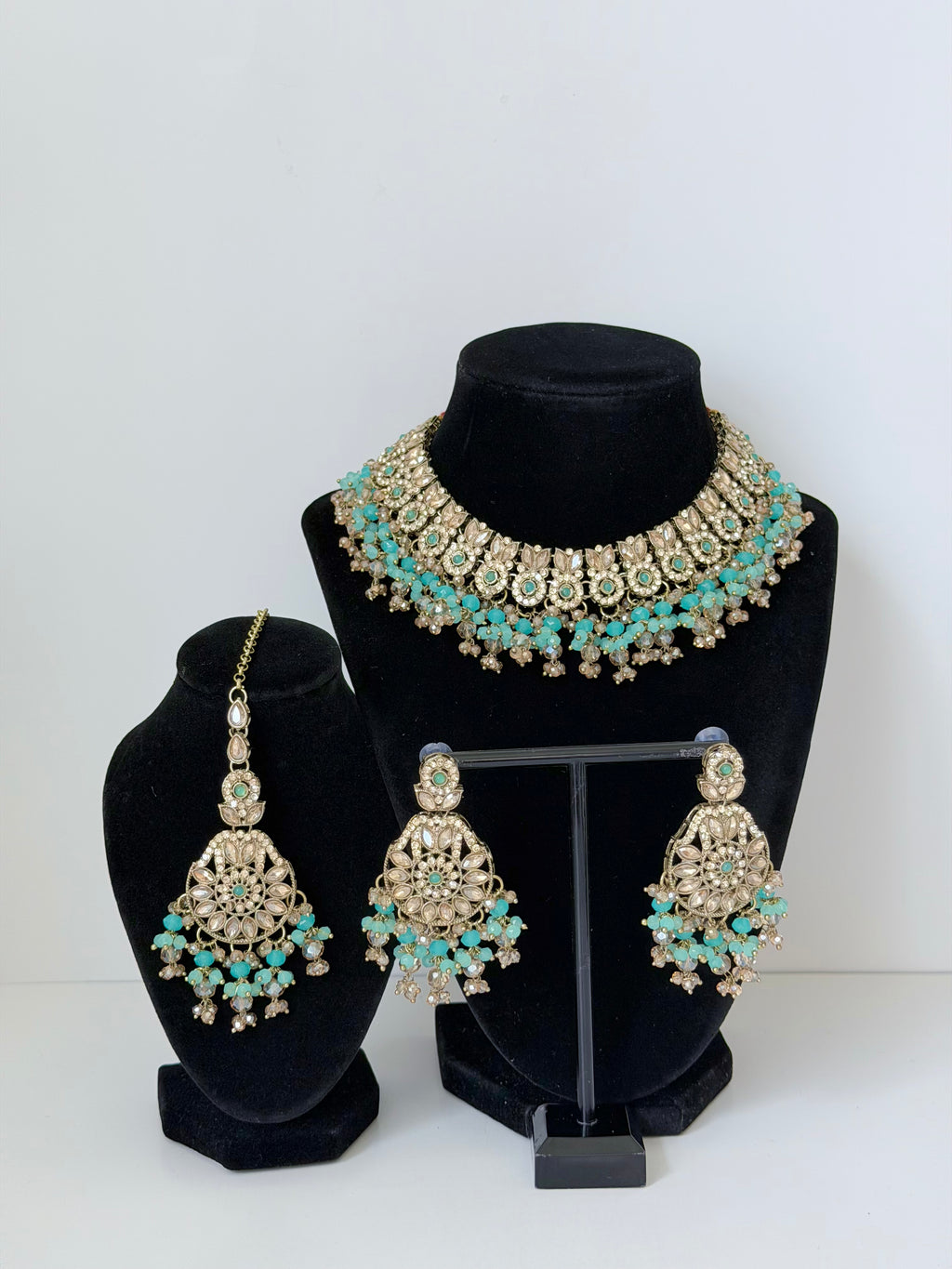 Bollywood Krithika Stonework Necklace Set with Earrings and Mangtika