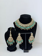 Bollywood Krithika Stonework Necklace Set with Earrings and Mangtika
