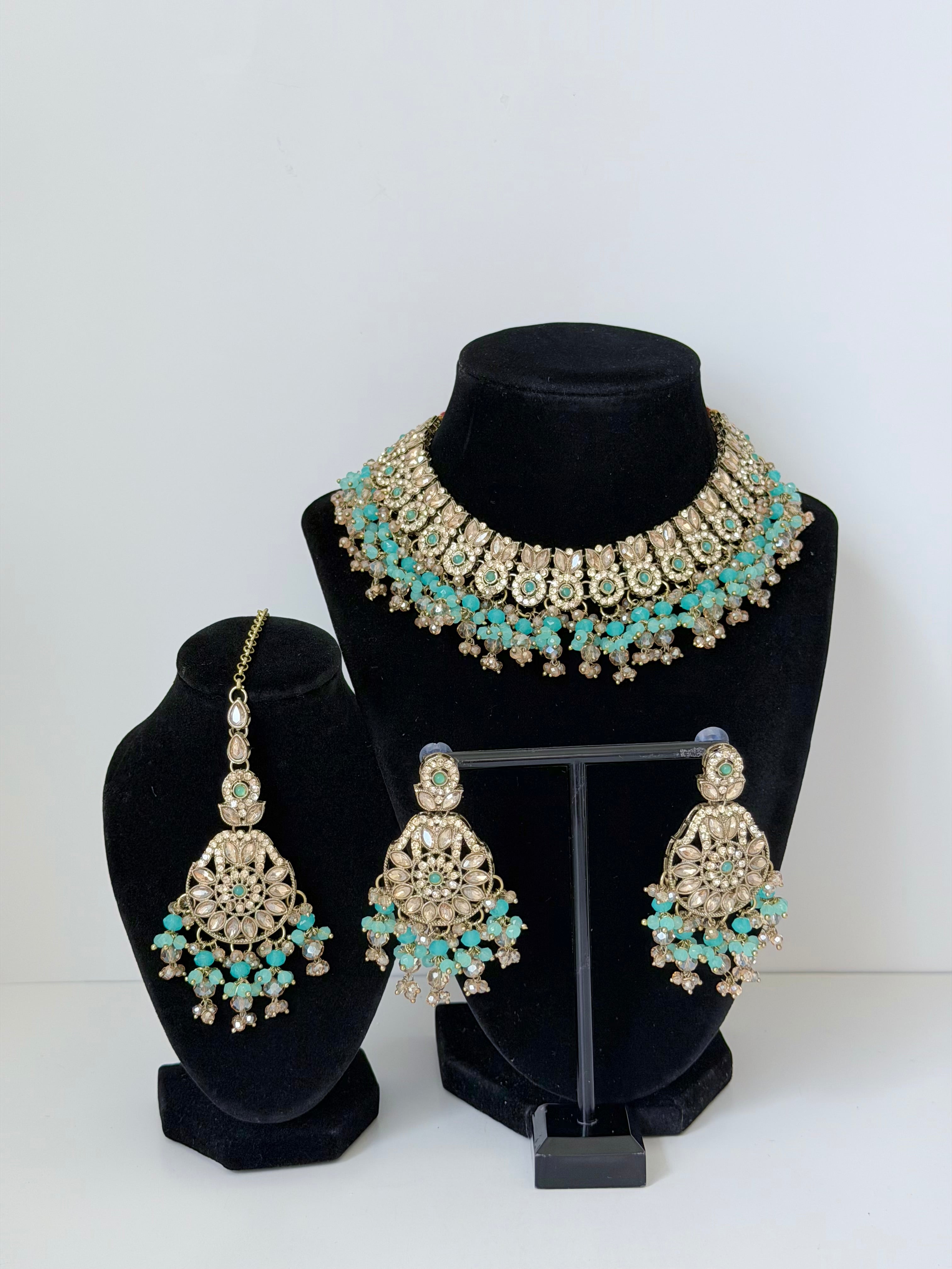 Bollywood Krithika Stonework Necklace Set with Earrings and Mangtika