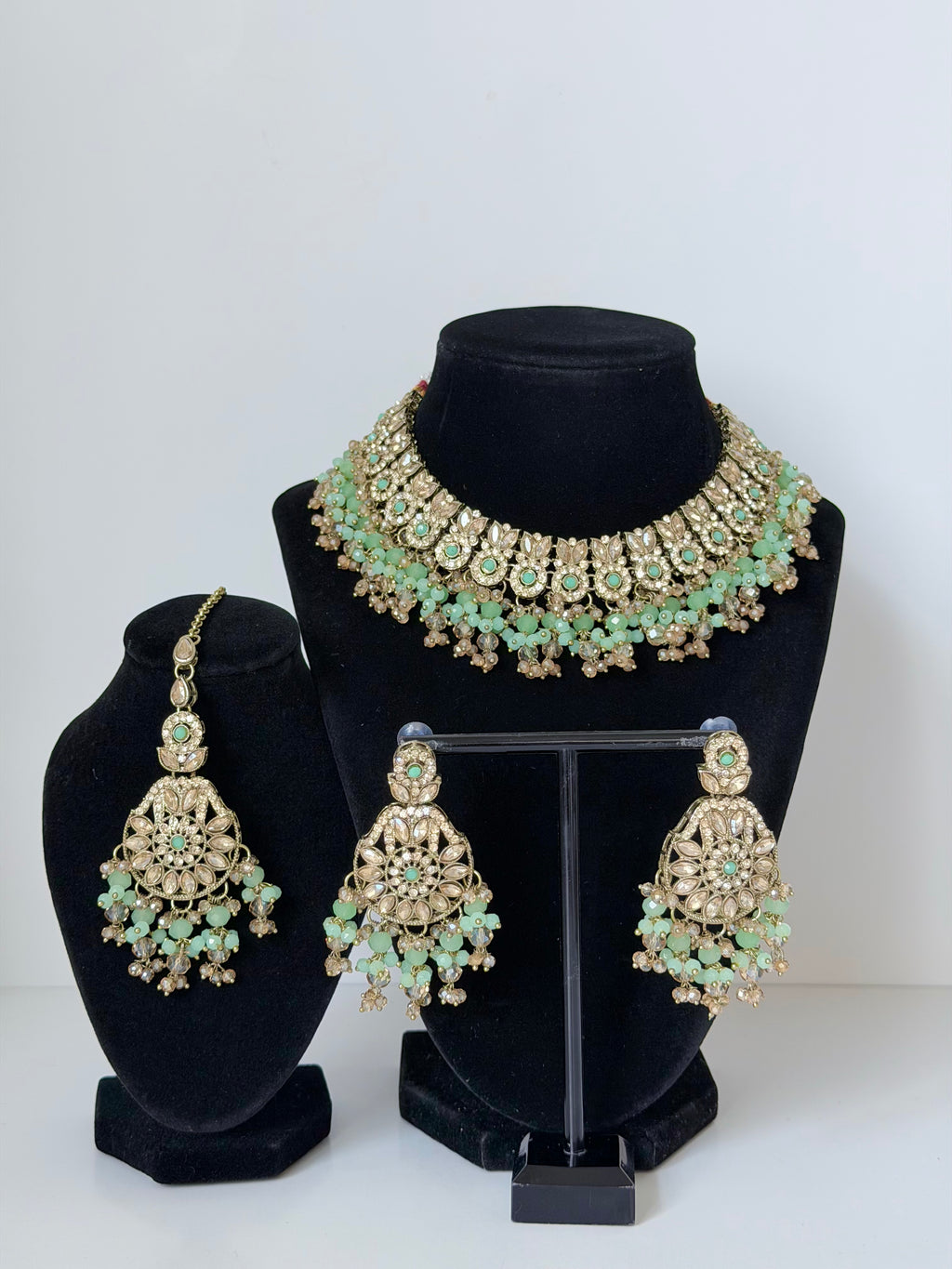 Bollywood Krithika Stonework Necklace Set with Earrings and Mangtika